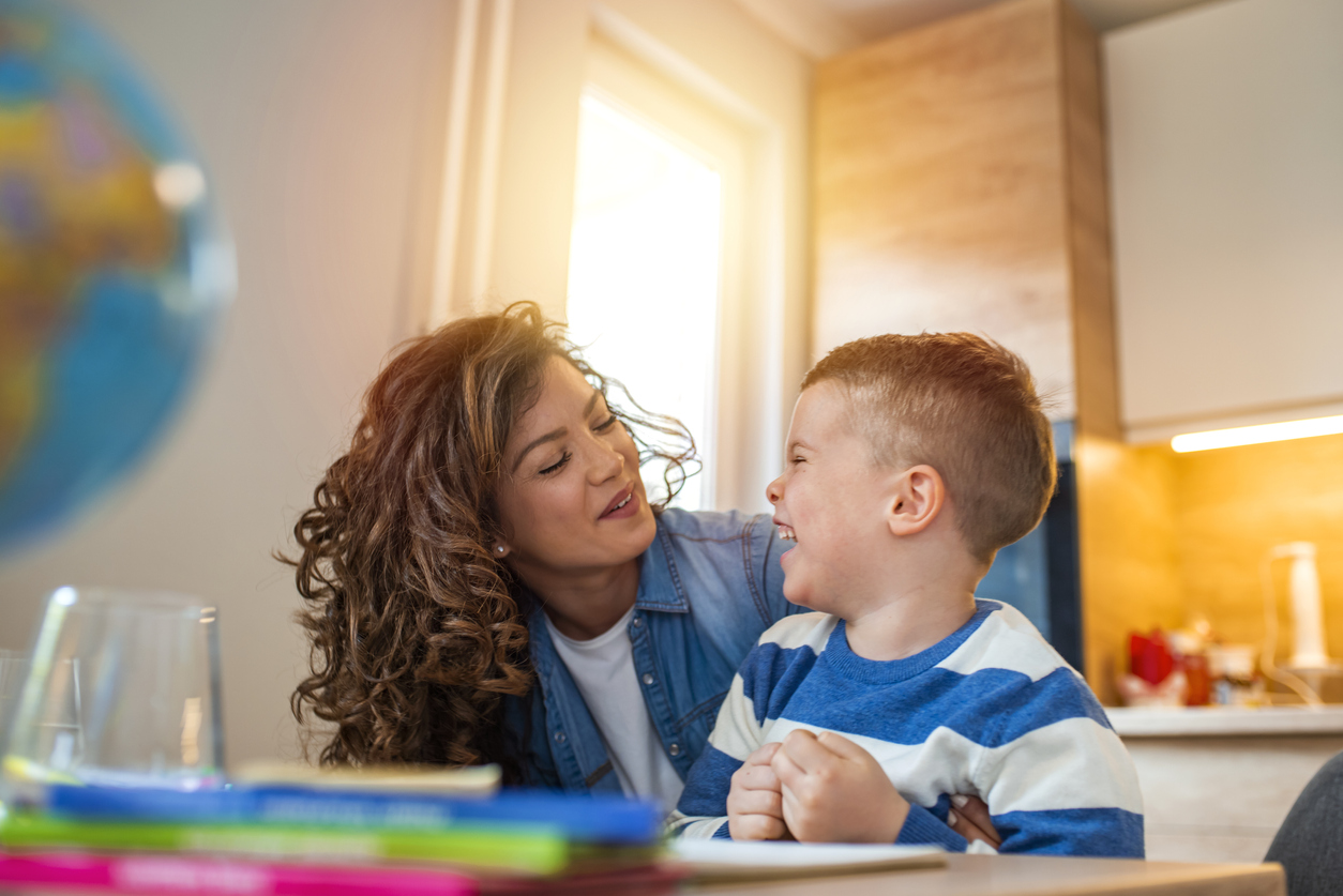 BCBA smiling during a session as a child experiences the effectiveness of ABA therapy for autism